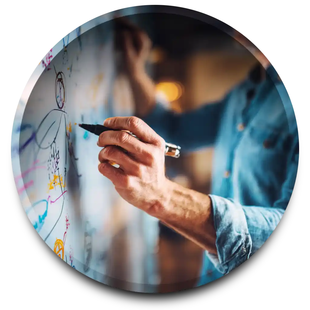 A man sits deep in thought, head on hands completely covered in colorful spilled paint.